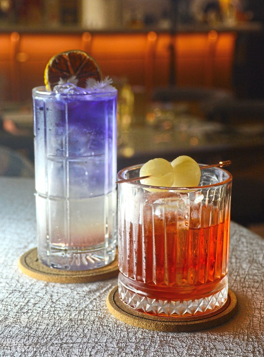 Get into the spirit of the season with cocktails like the Dragon’s Blessing (right) and Indigo Harmony at The Reserve at The Prestige Hotel.