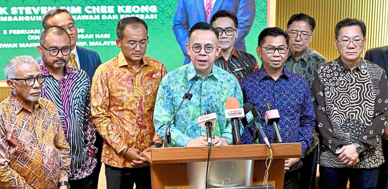 Good news: Sim (centre) speaking at a press conference on Barakat and Berkat, surrounded by industry leaders and senior officials. — RAJA FAISAL HISHAN/The Star
