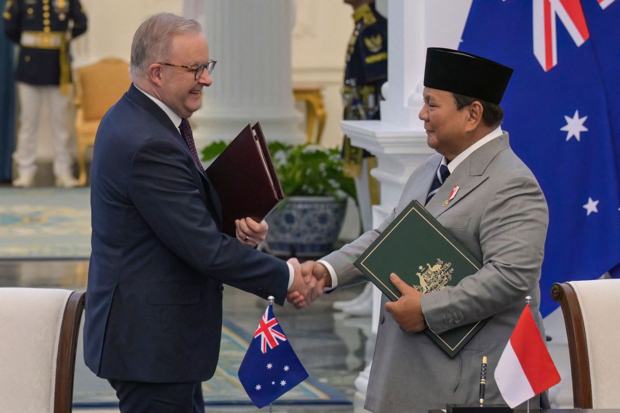Indonesia and Australia sign a treaty to boost cooperation and security ties