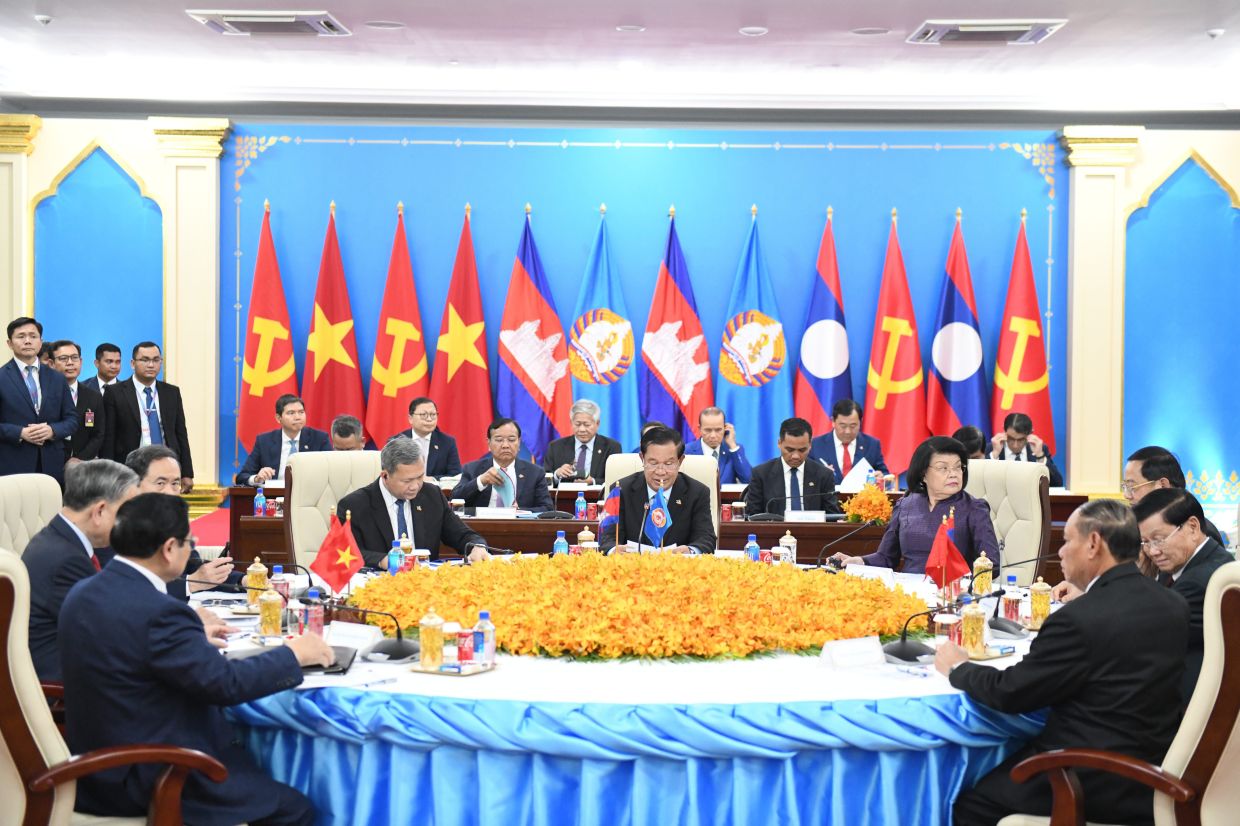 In this photo released by Agence Kampuchea Press (AKP), Cambodian People's Party's President Hun Sen (centre) attends a meeting with Vietnam's Communist Party General Secretary To Lam, and Laotian Communist Party General Secretary Thongloun Sisoulith in the Cambodian People's Party headquarters, Phnom Penh, Cambodia, Friday, Feb. 6, 2026. --AKP via AP Photo