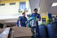 Penang Customs raids liquor-processing operation in oil palm plantation