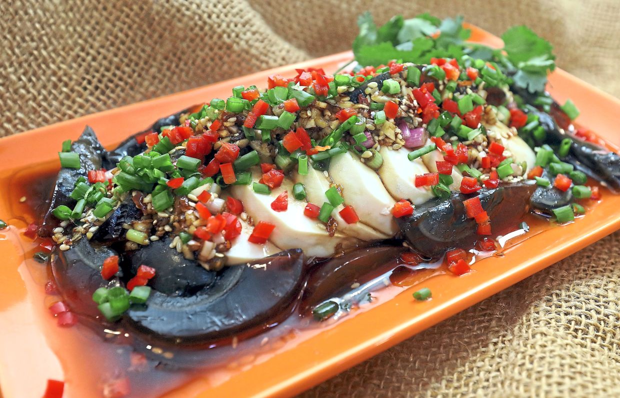 Smooth tofu, pungent century egg and a restrained dressing come together in a cold appetiser. — Photos: AZLINA ABDULLAH/The Star
