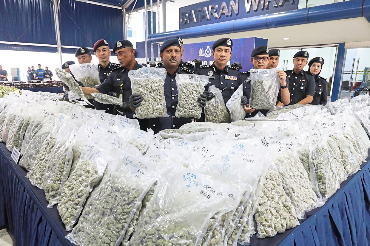 Big haul: Comm Hussein (centre) showing the seized drugs during the press conference at IPK Kuala Lumpur. — SAMUEL ONG/The Star