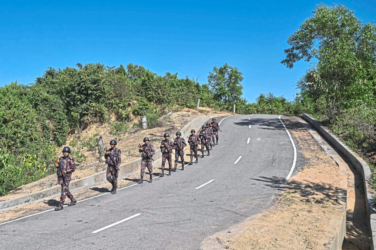 BGB personnel patrolling near the Bangladesh-Myanmar frontier in Bandarban district. In the dense hill forests along Bangladesh’s border with war-torn Myanmar, villagers are losing limbs to landmines, casualties of a conflict not of their making. — AFP