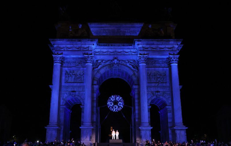 Olympics-Alberto Tomba and Deborah Compagnoni light Games cauldron in Milan