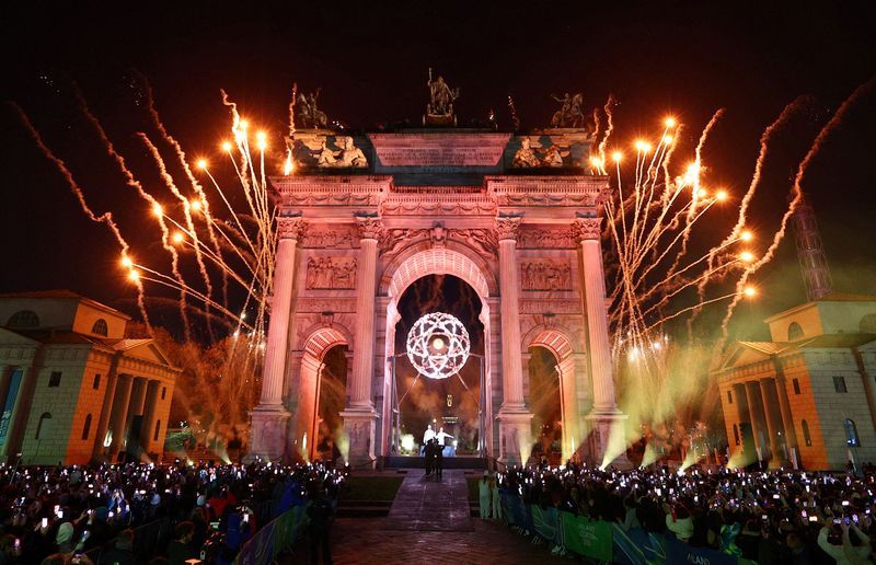 Olympics-Milan and Cortina d’Ampezzo burn dual flames for Winter Games