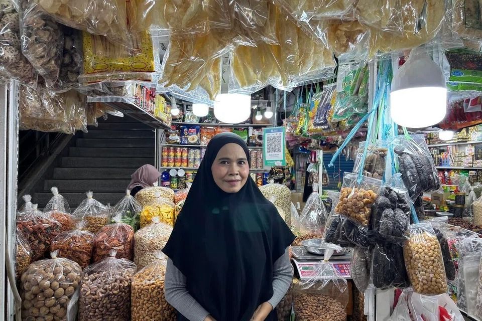 Dried fruits and nuts vendor Marisa Wangbenmat in front of her stall in Hat Yai's central market. - ST PHOTO: PHILIP WEN
