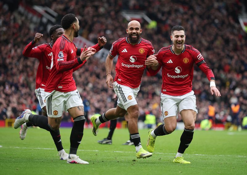 Soccer-Man Utd tighten grip on fourth place with 2-0 home win over Spurs