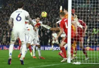 Soccer-Leeds beat Forest 3-1 to move nine points clear of relegation zone