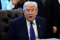 Trump signs order threatening tariffs on nations doing business with Iran