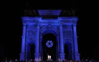 Olympics-Alberto Tomba and Deborah Compagnoni light Games cauldron in Milan