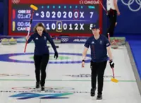 Olympics-Curling-Rock-solid Britain beat Canada to edge closer to playoffs