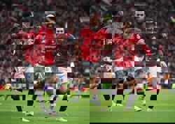 Soccer-Man Utd tighten grip on fourth place with 2-0 win over Tottenham