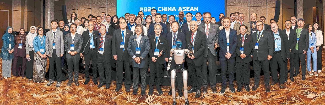Meeting of minds: Participants at the event posing for a group photo to commemorate regional cooperation in digital transformation.