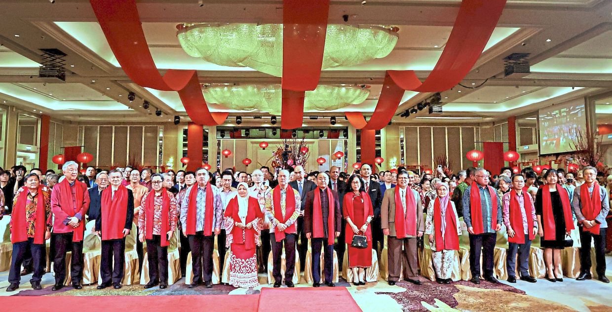 Celebrating together: Fadillah (seventh from left) and Ouyang (eighth from left) in a group photo with Dr Wee (second row, on Fadillah’s right) as well as other guests at the Chinese Embassy's 2026 Chinese New Year reception. — CHAN TAK KONG/The Star