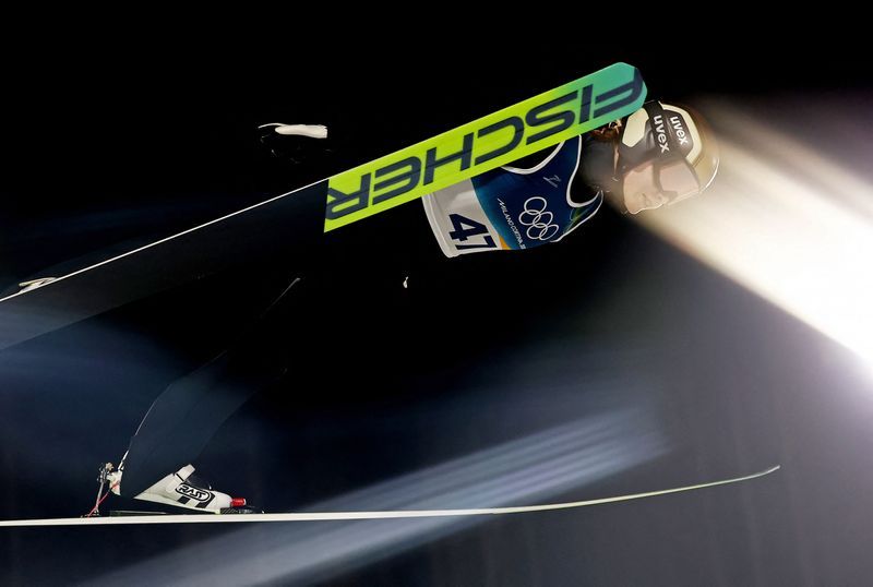 Olympics-Ski Jumping-Stroem soars to Olympic glory in Predazzo thriller over Prevc
