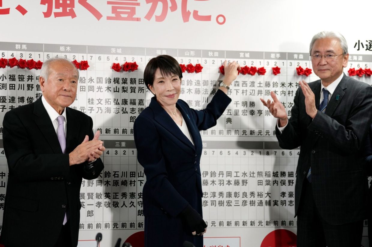 Sanae Takaichi, Japan's prime minister and president of the Liberal Democratic Party (LDP), center, at the party's headquarters in Tokyo, Japan, on Sunday, Feb. 8, 2026. Japanese Prime Minister Sanae Takaichi is set to secure a resounding victory, with polls showing her party on track to emerge from Sunday’s parliamentary election with a standalone majority in the lower house. -- Photographer: Toru Hanai/Bloomberg