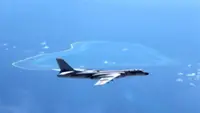 China conducts naval and air patrols around disputed South China Sea; promises move is done for peace in area