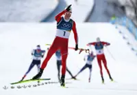 Olympics-Crosscountry-Norway's Klaebo wins gold in men's skiathlon after explosive finish