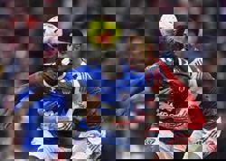 Soccer-Arsenal go nine points clear, Man Utd win again under Carrick