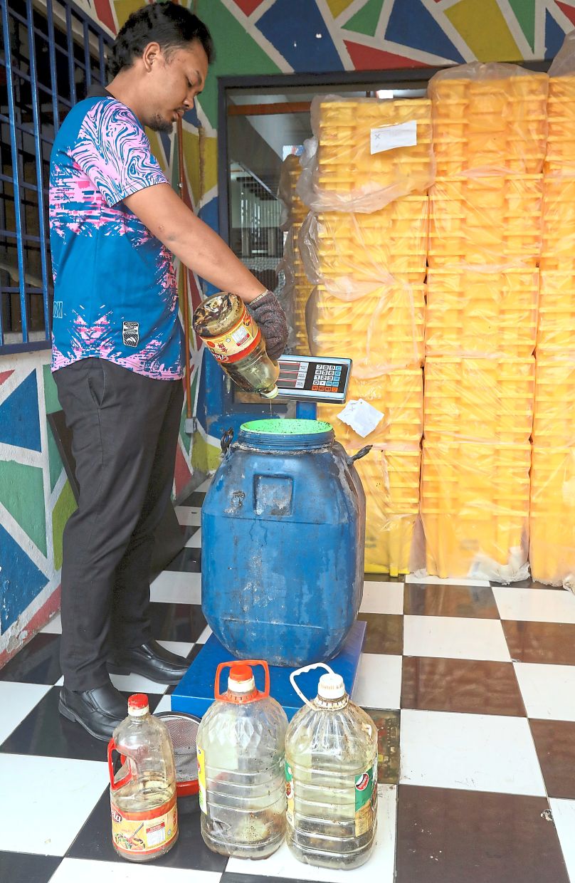 Cooking oil being weighed at PJ Eco Recyling Plaza. This community hub is a popular spot for locals to drop off their used cooking oil for recycling.