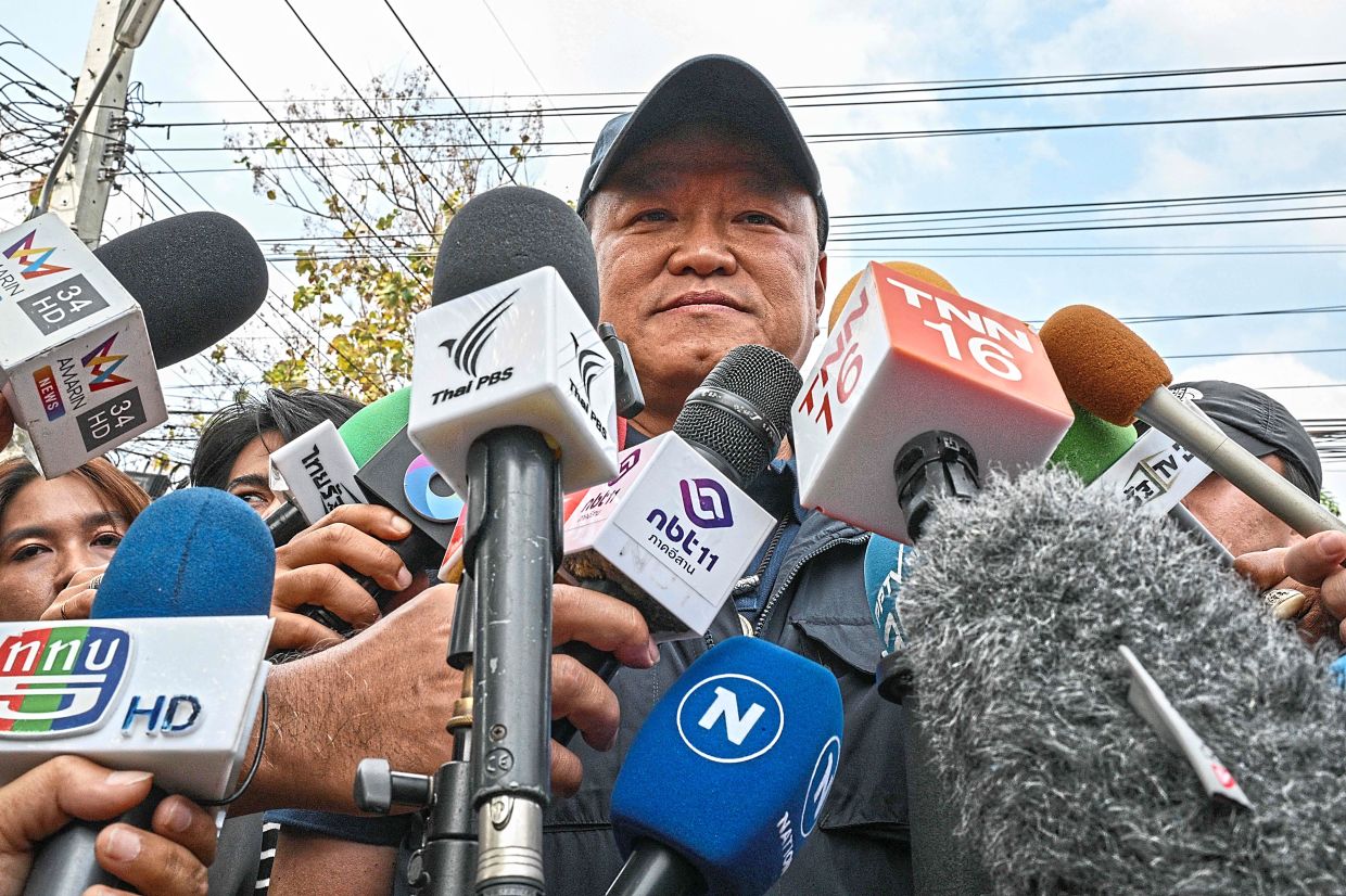 Home turf: Anutin speaking to the press after voting in Thailand’s general election at a polling station in Buriram province. — AFP