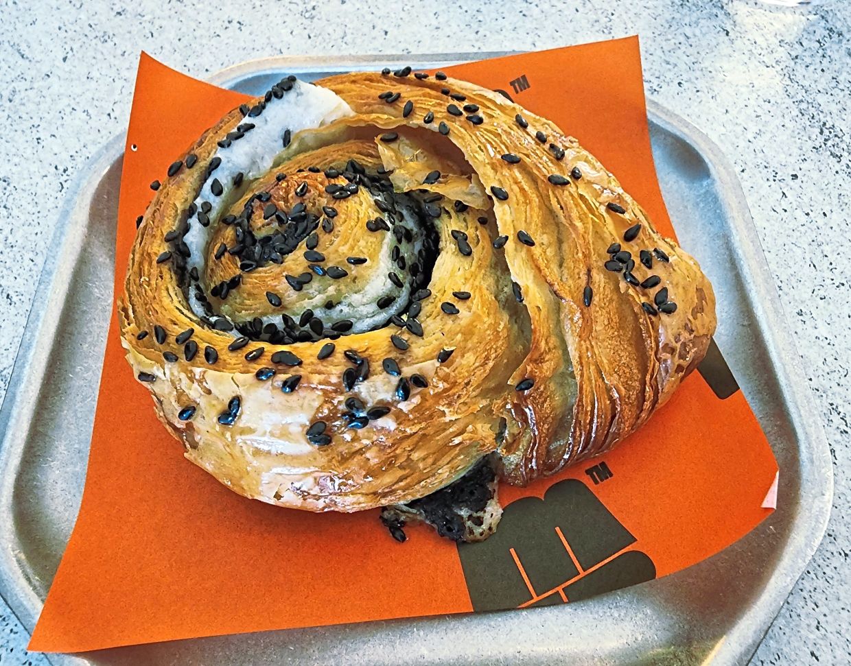 Filled with black sesame paste and mochi, the Tang Yuan escargot brings together nostalgic Chinese flavours. — ABIRAMI DURAI/The Star