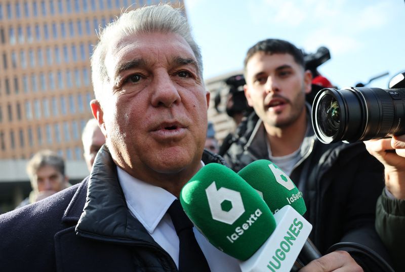 Soccer-Laporta steps down as Barcelona president to seek re-election