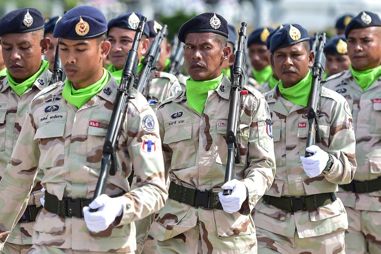 Thai civilian defence volunteers take part in a parade on the eve of the annual Defence Volunteers Day in Narathiwat, southern Thailand, on Monday, February 9, 2026. -- Photo by Madaree TOHLALA / AFP