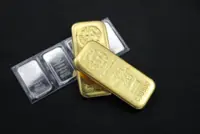 Gold, silver extend gains on softer dollar; investors eye US economic data