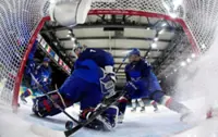 Olympics-Ice Hockey-Italy into quarters with nervy win over Japan