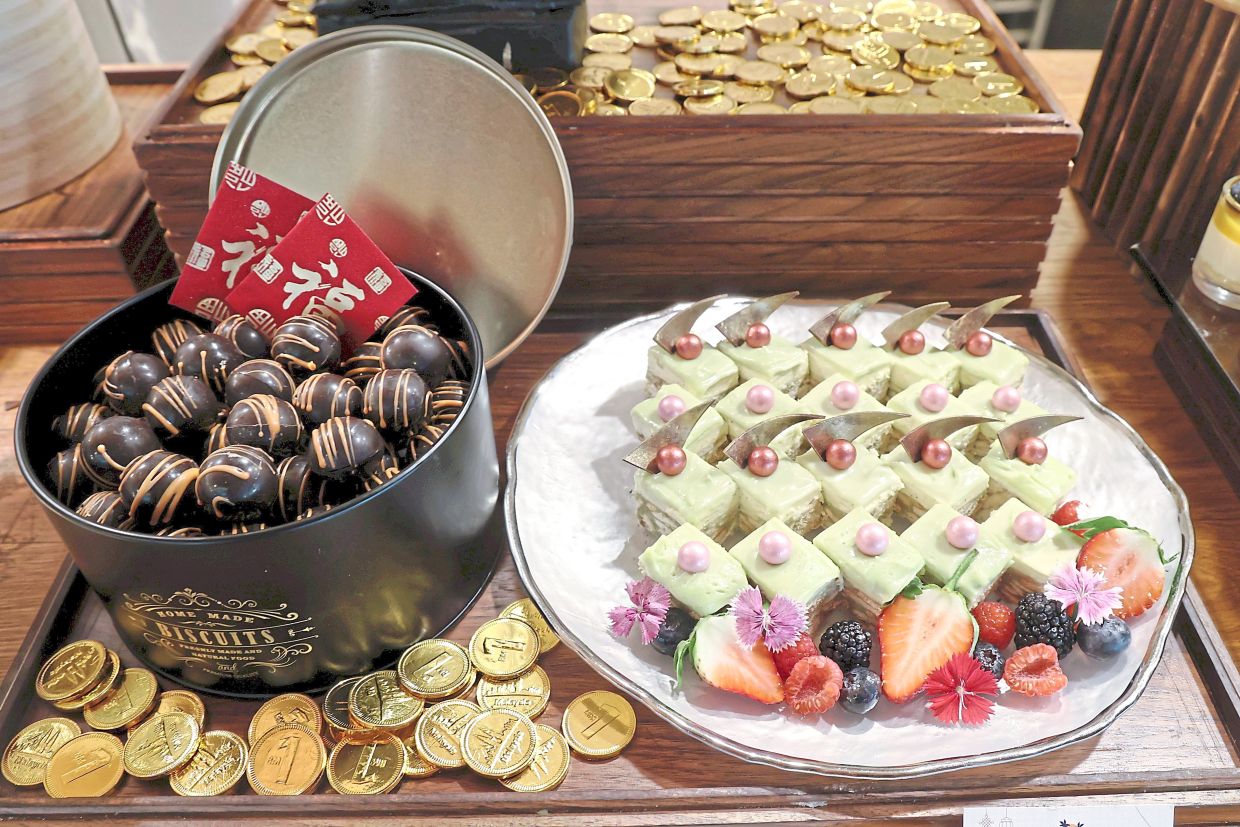 Chocolate Orange Truffle (left) and Pandan Kek Batik from the dessert section.