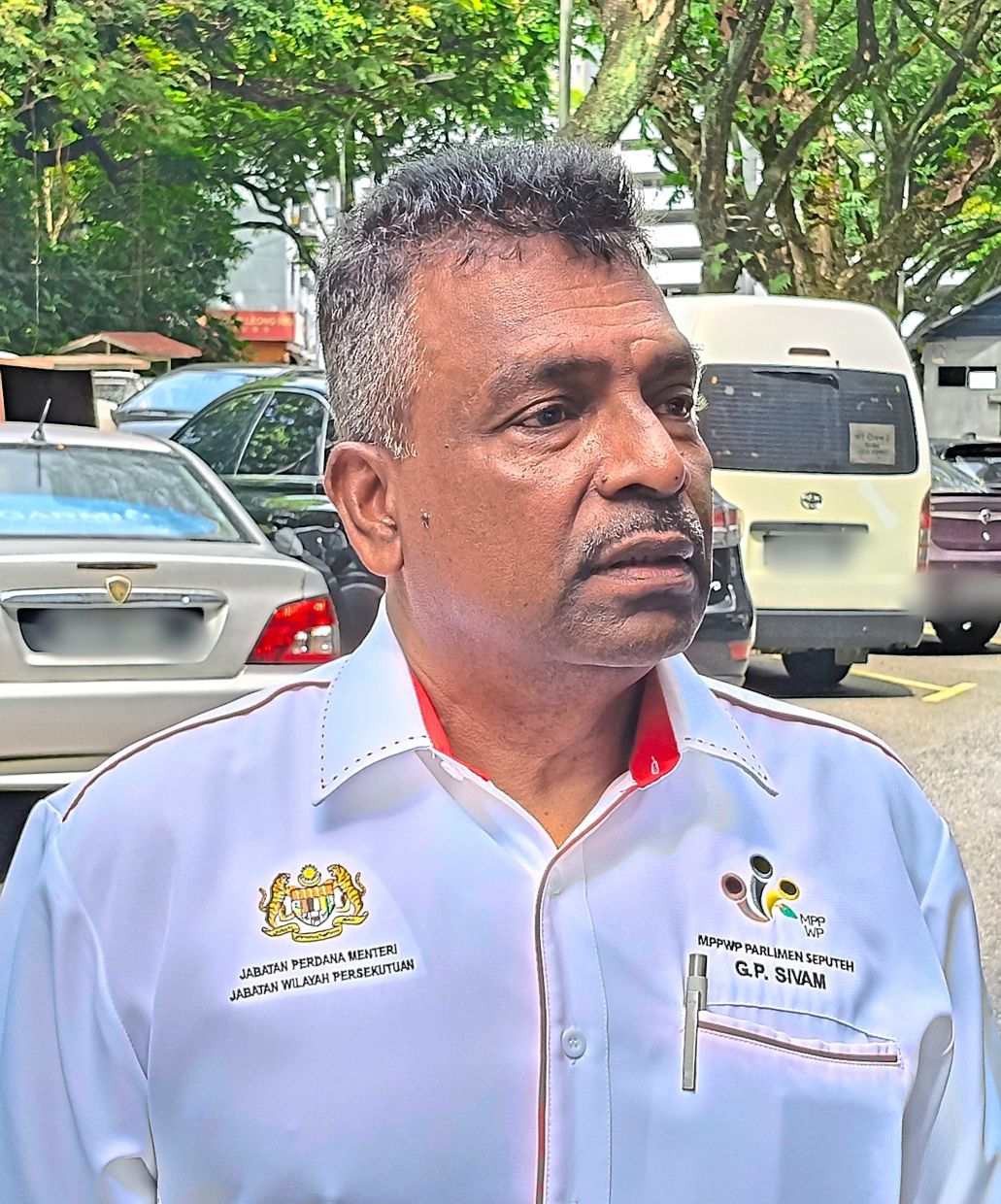 Sivam says residents cannot find parking space despite buying the RM70 pass as some bays are illegally hogged by businesses.