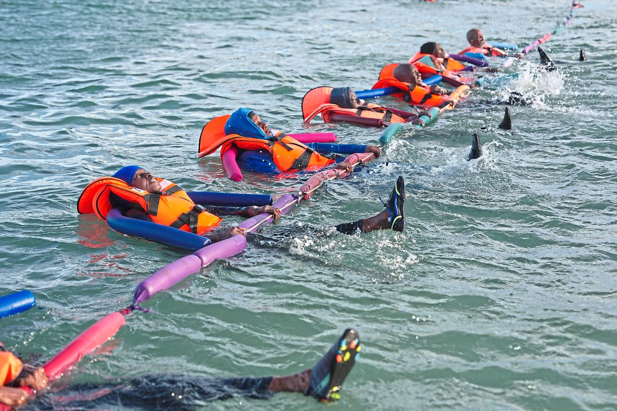 People with limited mobility issues receiving therapy. — AP