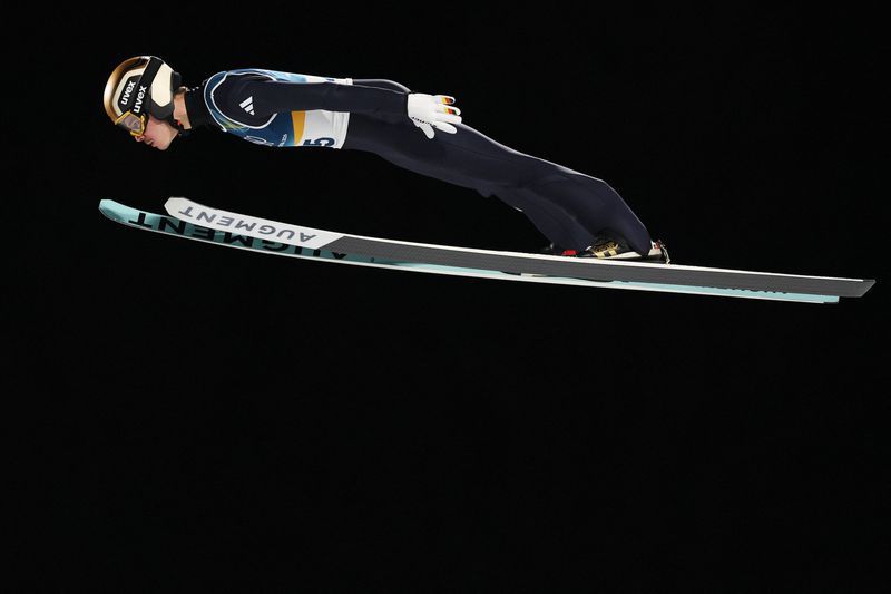 Olympics-Ski Jumping-Germany's Raimund soars to gold, Slovenia's Prevc falls short