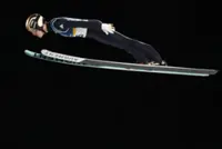 Olympics-Ski Jumping-Germany's Raimund soars to gold, Slovenia's Prevc falls short