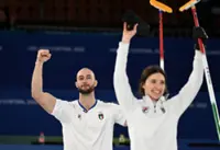 Olympics-Curling-Italy see off Britain in tight match to secure mixed doubles bronze