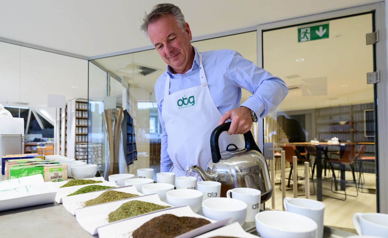Teataster Stefan Feldbusch prepares samples for his team to test. A top notch sense of smell is needed for this job and you can't get that from a university. The samples that don't make it get sent to the bin.
