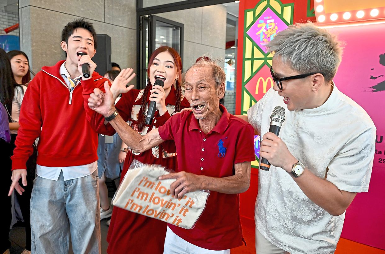 One of the elders singing along to Chinese oldies that took him down memory lane. — Photos by RAJA FAISAL HISHAN/The Star
