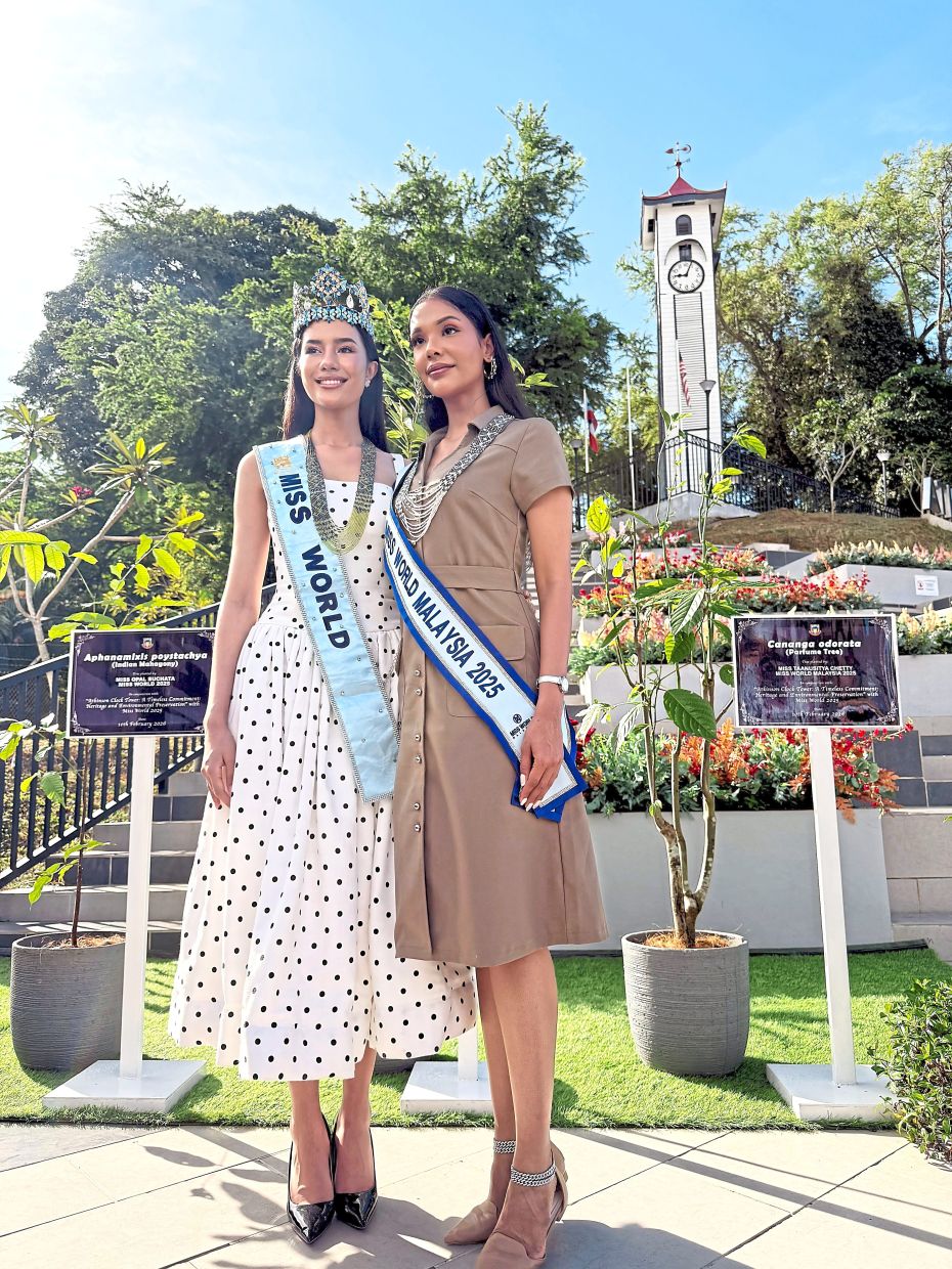 Beautiful inside and out: Taanusitya Chetty (right) and Opal Suchata posing for a picture after the tree-planting ceremony.