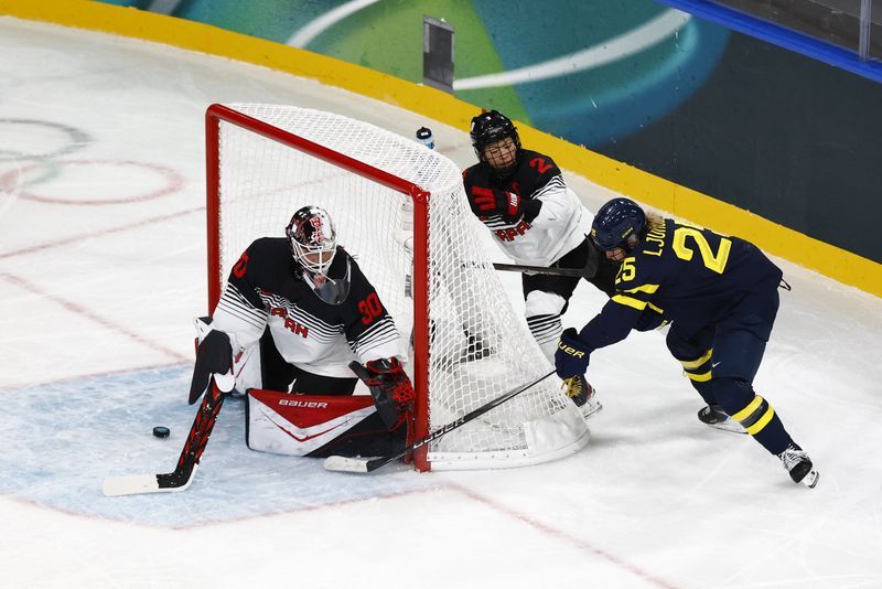 Olympics-Ice hockey-Japan goalie Halloran makes late debut, ends Games without conceding a goal