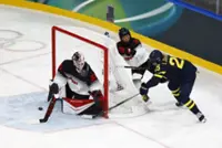 Olympics-Ice hockey-Japan goalie Halloran makes late debut, ends Games without conceding a goal