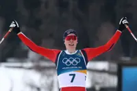 Olympics-Nordic Combined-Norway's Oftebro skis from behind to first individual gold