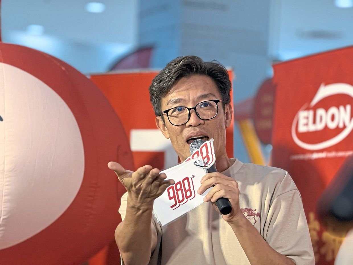 Wang taking part in a 988 FM Chinese New Year roadshow.