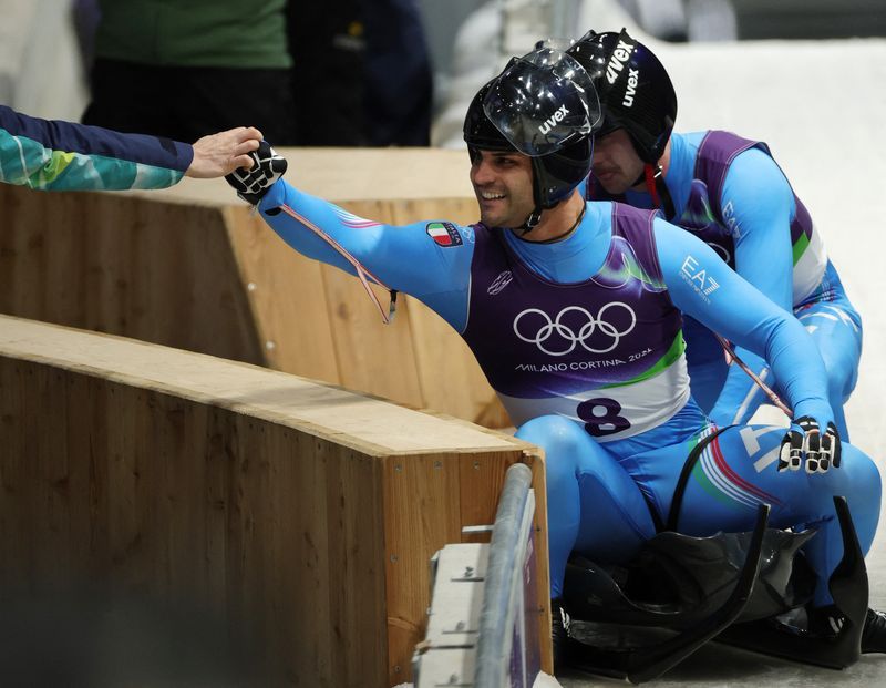 Olympics-Luge-Italian men complete golden doubles double for hosts