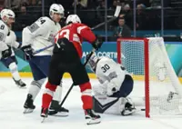 Olympics-Ice hockey-Switzerland cruise by France in Milan opener