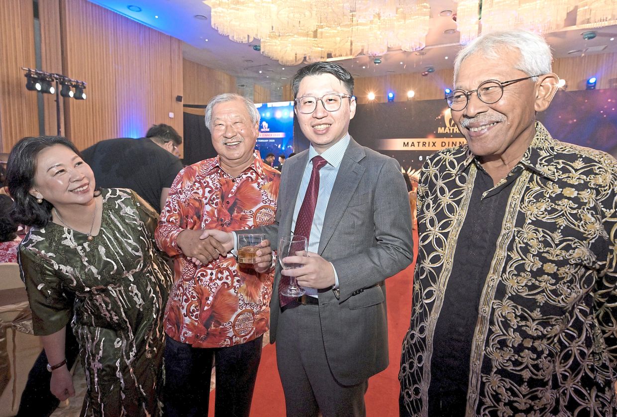 Above: Kevin (second from right) with his parents Tian Hock and Datin Seri Yong Chou Lian alongside Mohamad Haslah at the event.