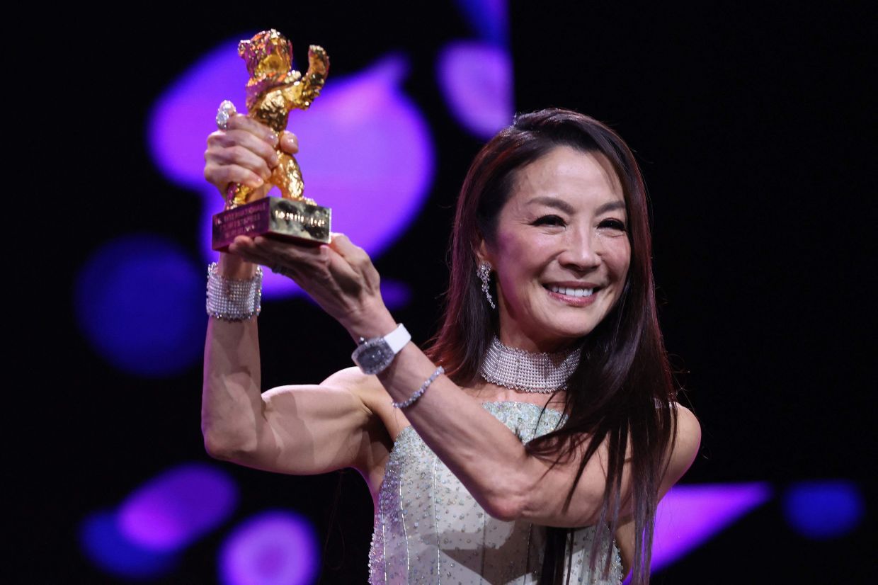 Malaysian actress Michelle Yeoh holds the trophy after being awarded the Honorary Golden Bear during the opening ceremony of the 76th Berlinale, Europe's first major film festival of the year, in Berlin on February 12, 2026. Photo: AFP