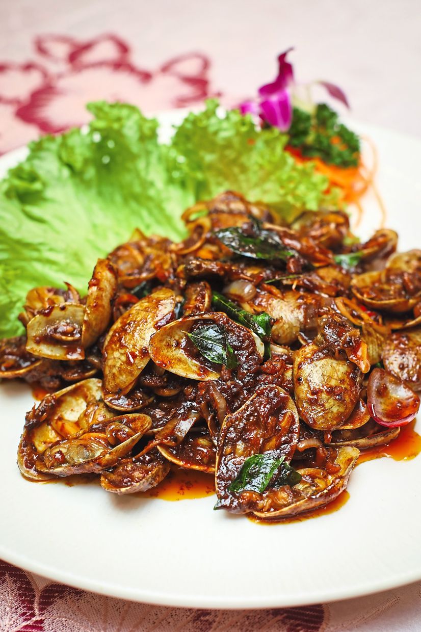 Kam heong is a cooking style that is popular in Chinese restaurants across Malaysia and reflects the inventive use of local ingredients like curry leaves and lemongrass as well as Chinese culinary staples like soy sauce. — LEONG WAI YEE/The Star