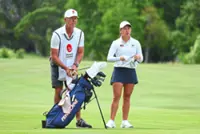 Jeneath eight strokes back after blustery start to title defence